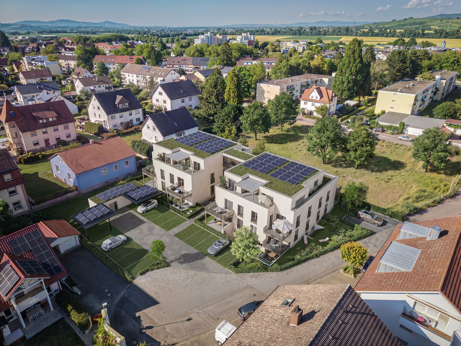 Vogelperspektive der Wohnanlage UrbanDuo mit beiden Häusern, Gartenflächen und Stellplätzen